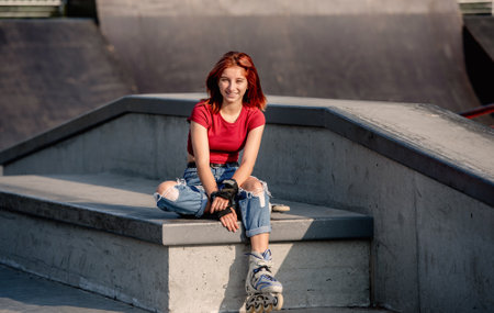 Girl with roller skates outdoorsの写真素材