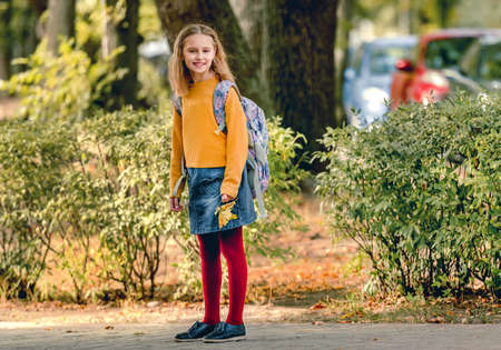 Preteen school girl with backpack