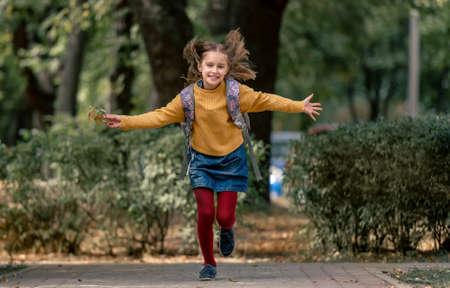 Preteen school girl with backpackの写真素材