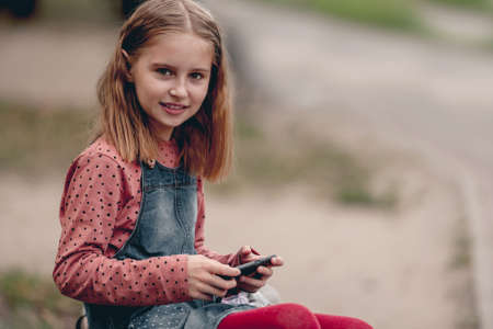 School girl with smartphoneの写真素材