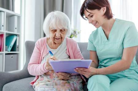 Elderly woman and nurse
