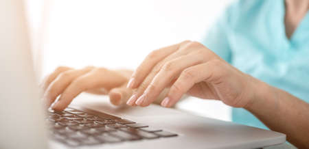 Woman hands with laptop