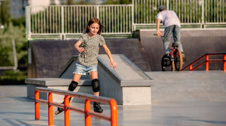 Girl with roller skates outdoorsの写真素材