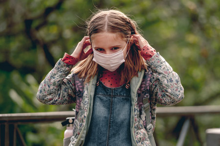 Schoolgirl wearing face mask