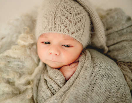 Newborn baby boy studio portrait