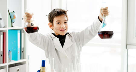 School boy in chemistry class