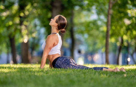 Girl doing yoga at nature