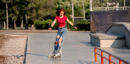 Girl with roller skates outdoorsの写真素材