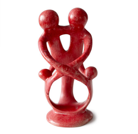 Traditional red figurine with creative design isolated on white background. Handicraft statuette objectの写真素材