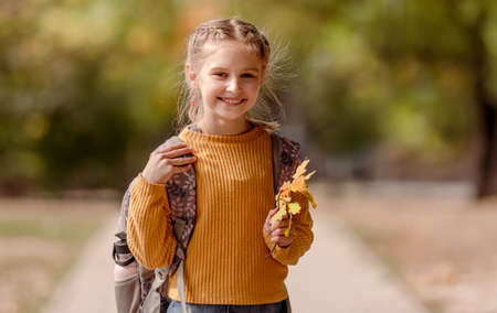 Preteen school girl with backpack
