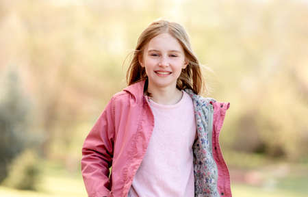 Portrait of beautiful little girl outdoorsの写真素材