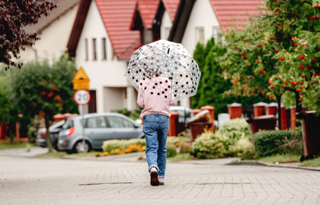 Preteen girl with umbrellaの写真素材