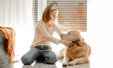 Girl with golden retriever dogの写真素材