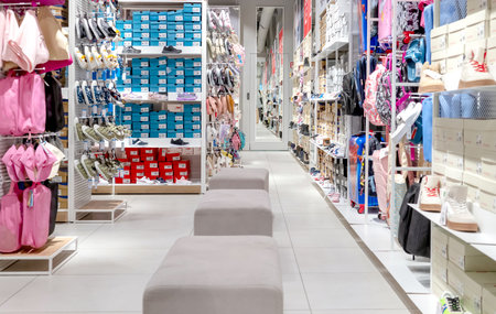 Showcase with shoes and travel goods in supermarket