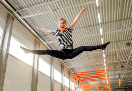 Pretty girl in trampoline park having funの写真素材