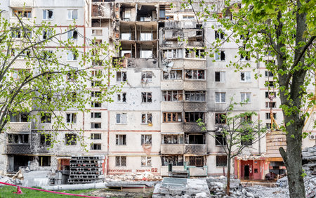 Destroyed residential building after russian missle rocket attack during war in Ukraine. Ruins in city Kharkivの写真素材