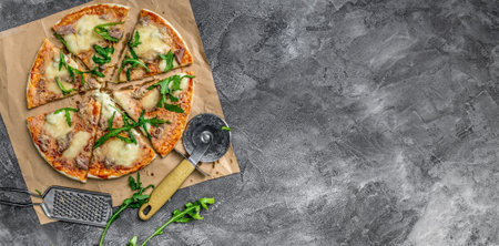 homemade pizza from tuna, mozzarella cheese, parmesan and rucola. top view. space for textの写真素材