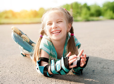 Little girl in roller skates at a parkの写真素材