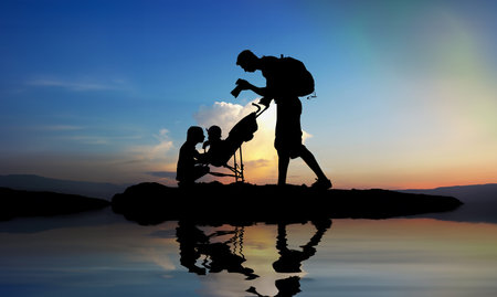 Dad photographing of their children at sunsetの写真素材