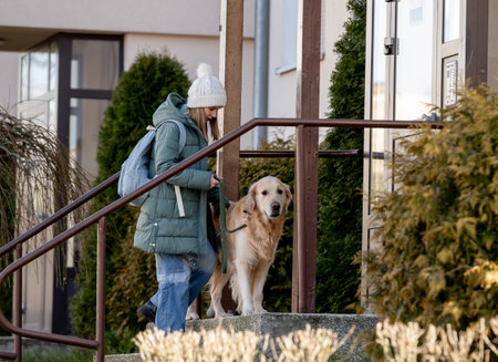 Girl With Golden Retriever Returns Home, Child With Dogの写真素材