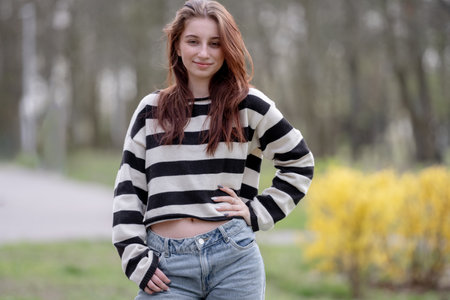 Beautiful Young Girl Poses Elegantlyの写真素材