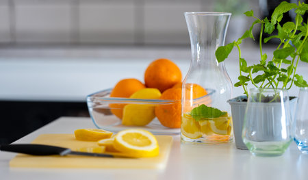 Preparing Homemade Lemonade From Lemons And Oranges Is A Refreshing Activityの写真素材