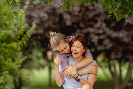 Mother And Daughter Happily Having Fun Togetherの写真素材