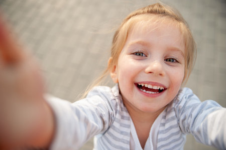 Girl Laughing Taking Selfie Close-Up Portraitの写真素材