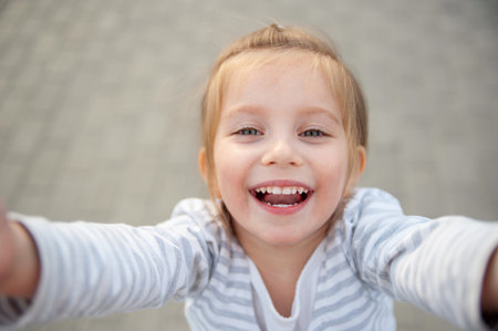 Girl Laughing Taking Selfie Close-Up Portraitの写真素材