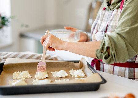 Close-Up Of Woman Baking Stuffed Cookies