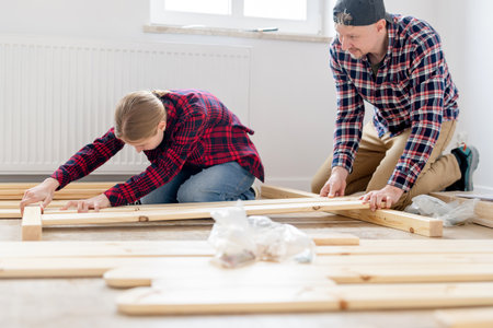 Dad And Daughter Building A Table At Homeの写真素材
