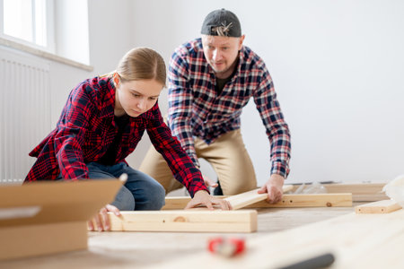 Dad And Daughter Building A Table At Homeの写真素材