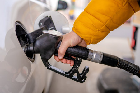 Refueling Car With A Close-Up Of A Hand