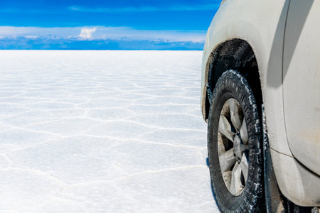 Off-Road Tire On Salt Flats Of Salar De Uyuni Bolivia And Wheel Of Vehicle On Salar De Uyuni Salt Flat Boliviaの写真素材