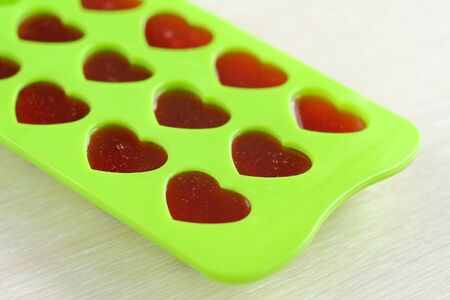 In the form of green ice jelly in the form of heartの写真素材
