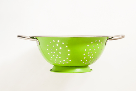 Old green metal colander sieveの写真素材