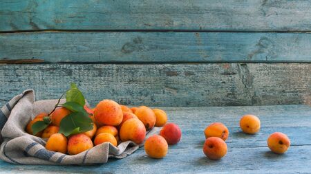Fresh apricots on wooden background.の写真素材