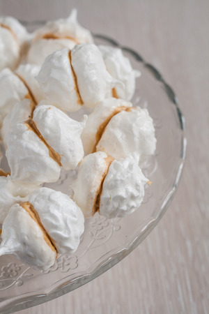 kiss meringue cakes with cream Charlotte.の写真素材