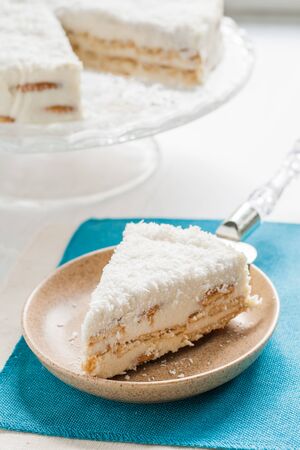 On a piece of coconut cake plate.の写真素材