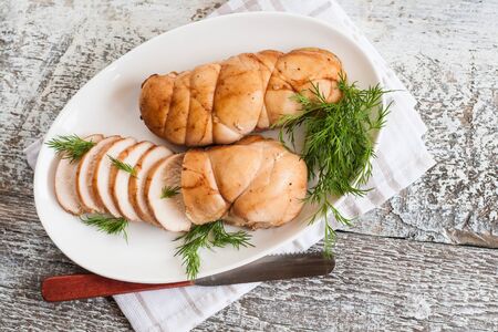 chopped meat fillet baked with herbs on a plate.の写真素材
