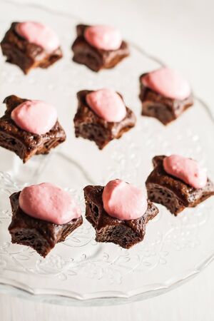 Chocolate cupcakes with pink stars-cream celebratory glass standの写真素材