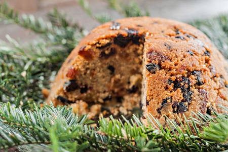 Christmas plum pudding in the section on fir branchesの写真素材