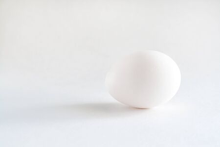 one white egg isolated white background.の写真素材