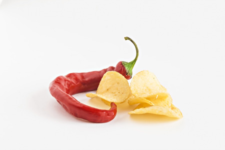 potato chips and chili in isolated white plate.の写真素材