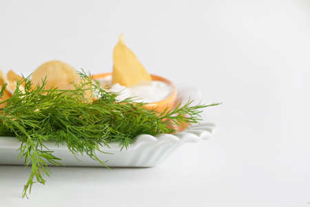 chips with sour cream and dill sauce isolated.の写真素材