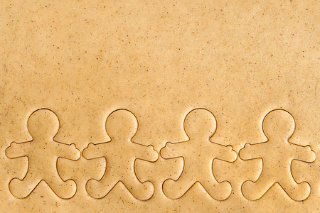 Roll out the dough cut Christmas figures.