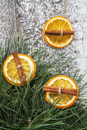 pine branches, dried orange and cinnamon sticks.の写真素材