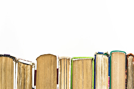 many books standing in a row isolated.の写真素材