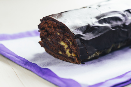Chocolate roulade with lemon Kurd watered dark chocolate.の写真素材