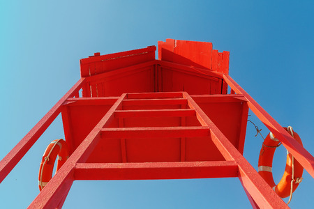 red rescue tower with a lifeline against the blue sky.の写真素材